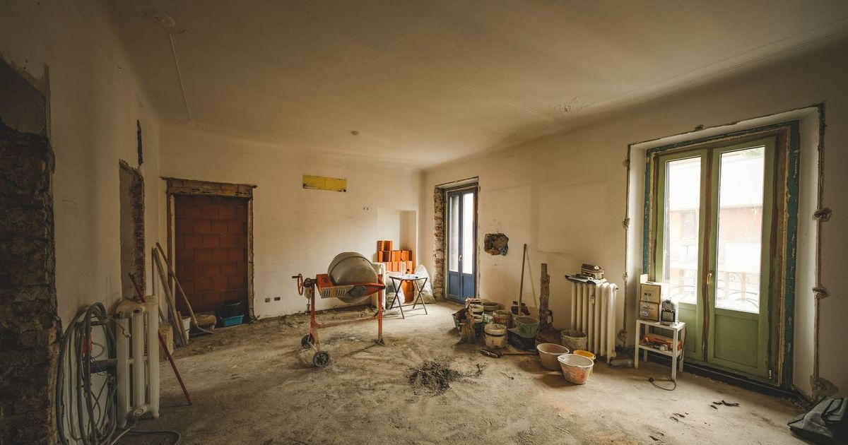 Sunny room part way through a renovation with tools and materials